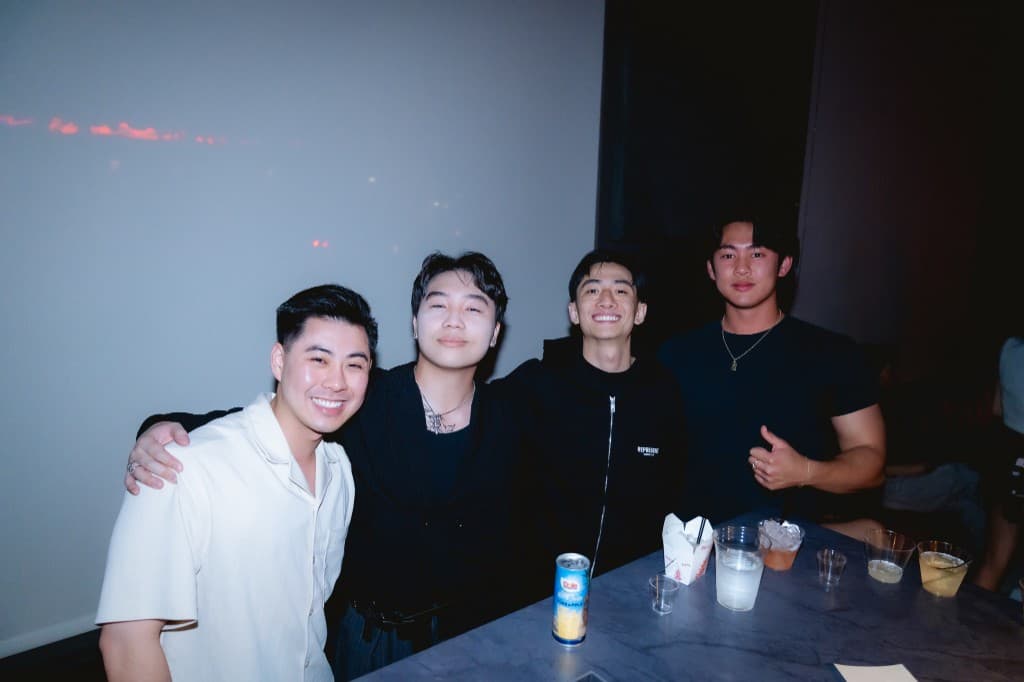 Group of guests at a table with drinks